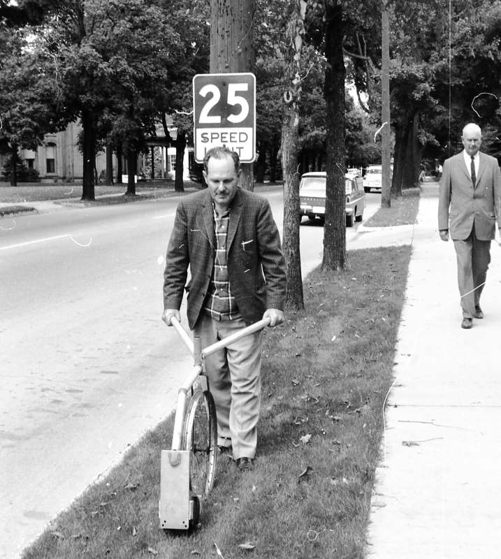 Gale Highsmith measuring distance to known point.