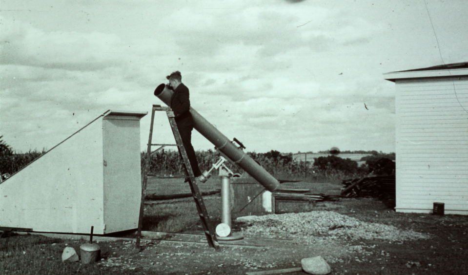 George Diedrich at the eyepiece of his telescope.
