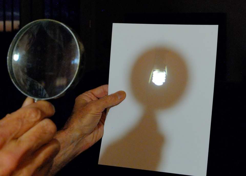 Light bulb projected onto paper with a magnifying glass. MAS image by Gene Hanson. Light bulb projected onto paper with a magnifying glass. MAS image by Gene Hanson.